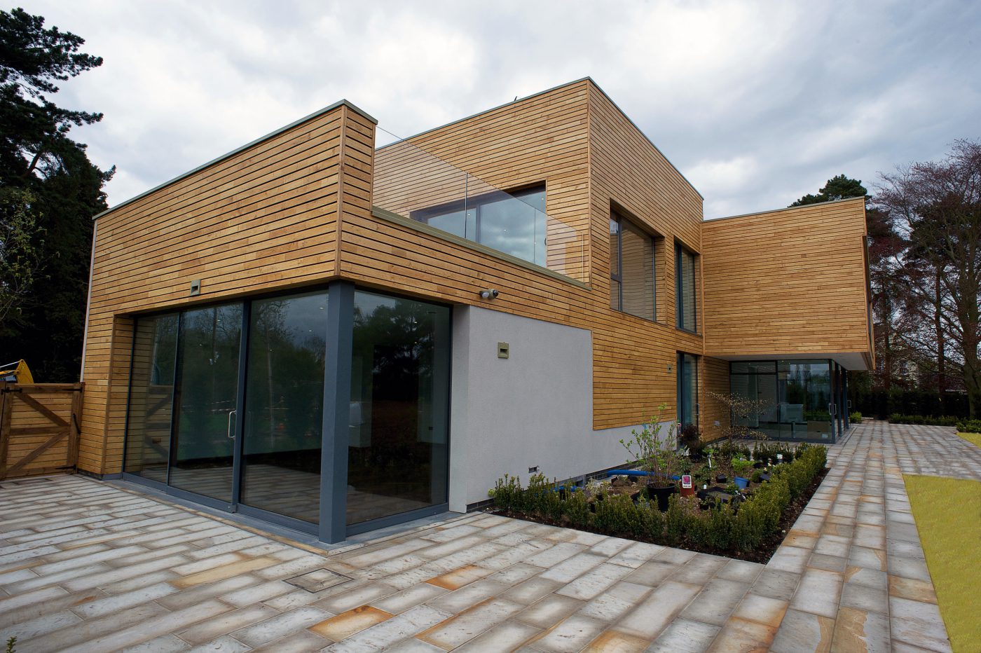 Timber-clad contemporary house with a glazed corner